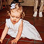 Alma participe au concours pour gagner de l'argent avec cette photo : toddler, child, white_dress, bow, crawling, floor, tile, indoor, party, people, legs, feet, curly_hair, young_child, cute, girl, casual, event, social, expression