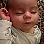 baby, sleeping, infant, blanket, leopard_print, onesie, hand, face, closed_eyes, cute, peaceful, soft, child, portrait, cozy, resting, skin, head, young, comfort