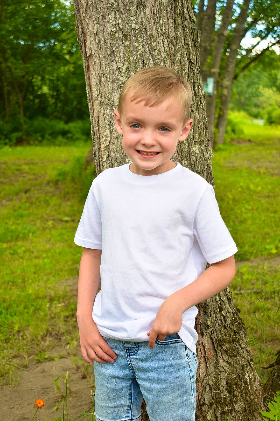Jakob joined the competition — help win amazing prizes! child, child_model, fun, grass, green, jeans, joy, people_in_nature, person, photo_shoot, photography, plant, shorts, smile, standing, summer, t_shirt, toddler, tree, trunk