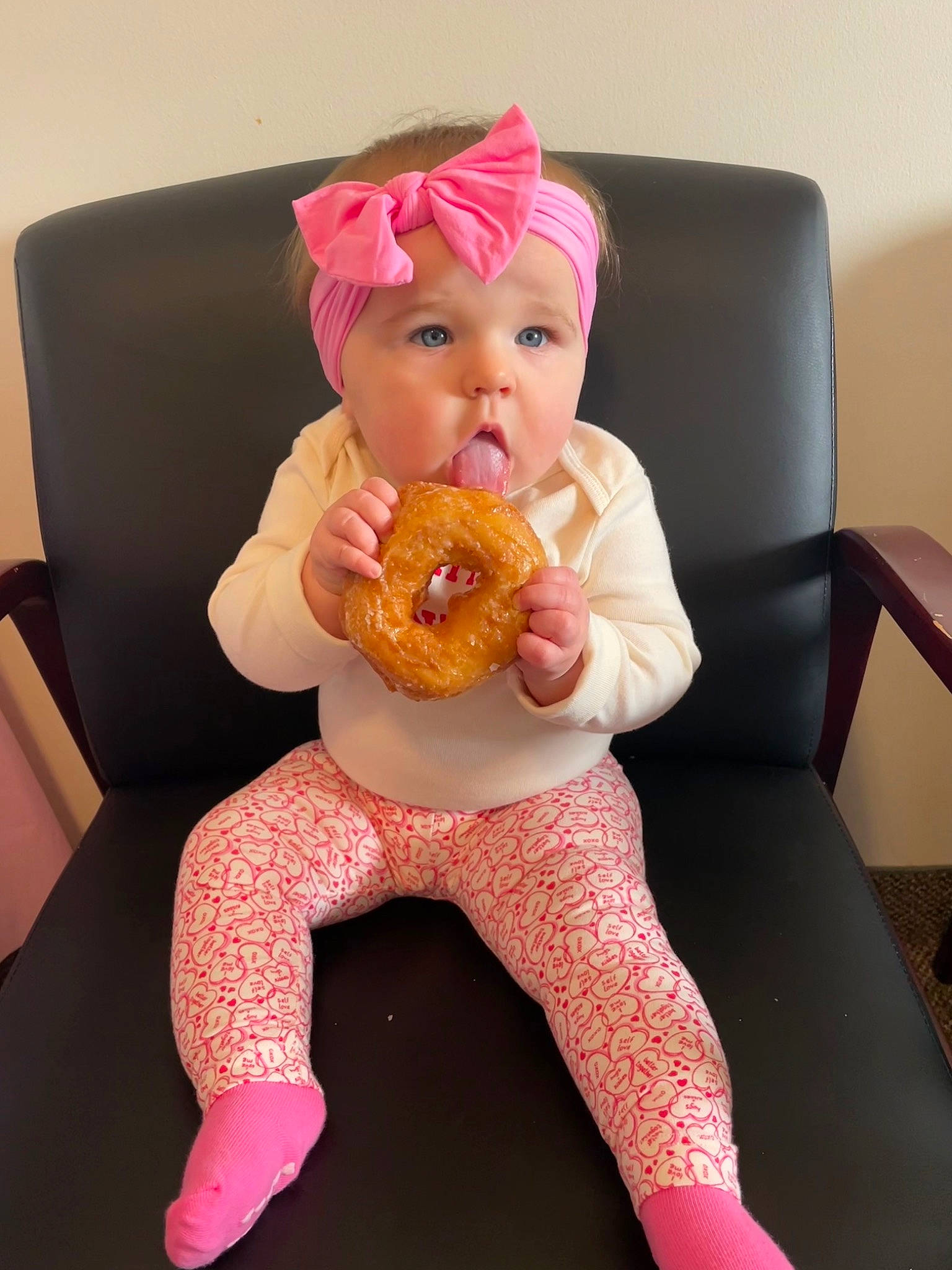Emersyn is registered to the contest to win money with this photo: baby, baby_toddler_clothing, chair, child, costume, face, fun, hat, headwear, human_leg, knee, magenta, peach, person, pink, plate, sitting, sleeve, sweetness, tableware