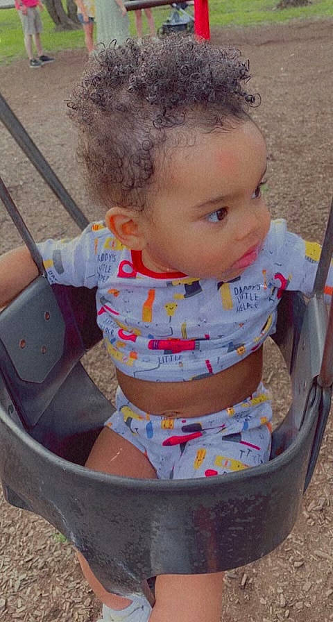 Rahmond Jr. is registered to the contest to win money with this photo: baby, baby_carriage, baby_products, baby_toddler_clothing, cheek, child, design, facial_expression, fun, grass, hairstyle, happy, head, leisure, people, person, pink, play, sitting, skin
