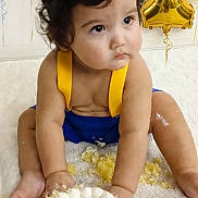 Joseph joined the competition — help win amazing prizes! baby, birthday, cake, balloons, crown, blue_clothing, yellow_clothing, messy, celebration, sprinkles, white_background, child, 1st_birthday, sitting, curious, festive, indoors, cute, portrait, party
