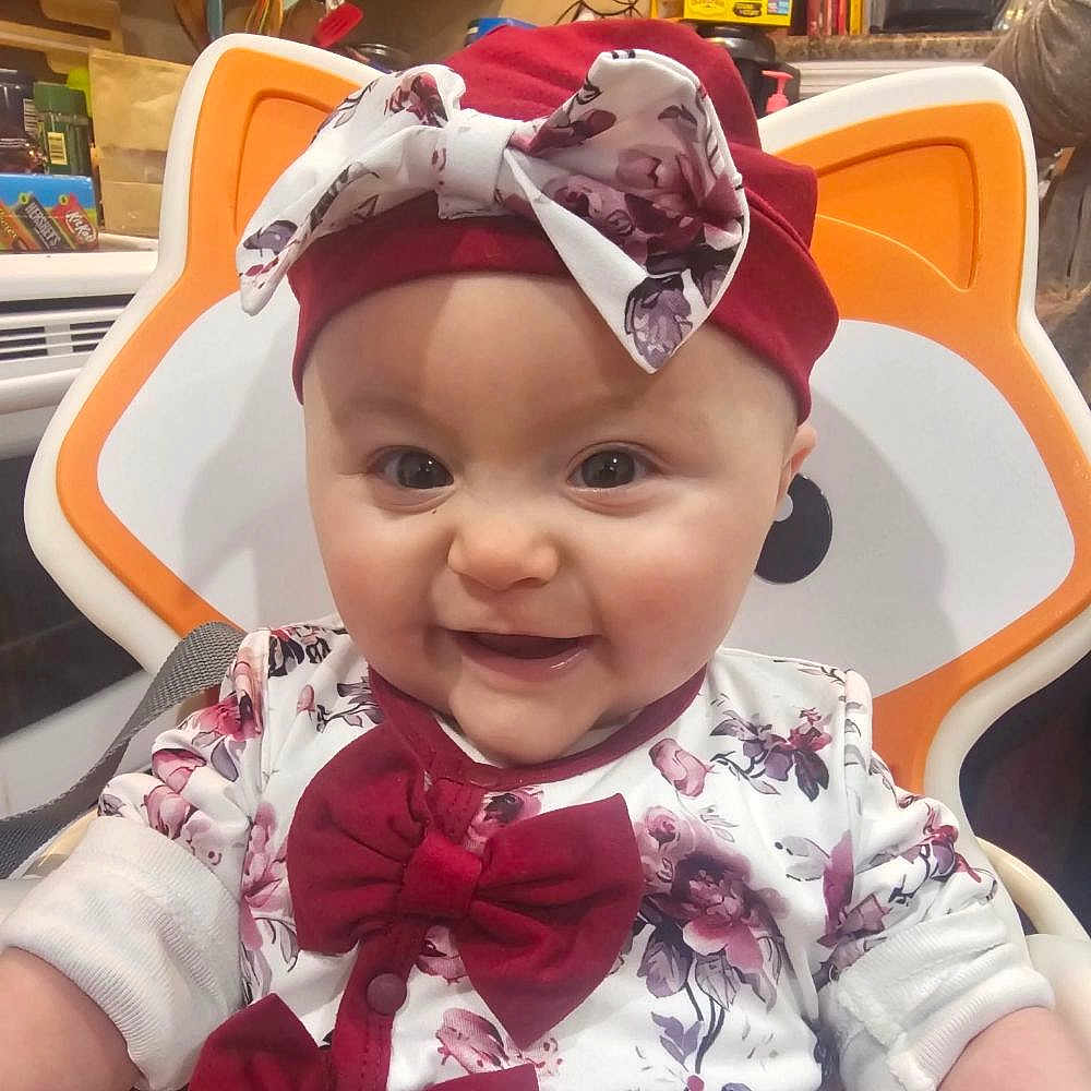 Cecilia joined the competition — help win amazing prizes! accessories, baby, babylaughing, bowtie, chair, clothing, face, formalwear, furniture, happy, hat, head, headband, person, photography, plant, portrait, scarf, smile, tie