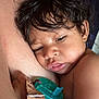 Malcolm Jr is registered to the contest to win money with this photo: baby, infant, sleepy, close_up, pacifier, arm, skin, hair, resting, peaceful, child, face, hand, strap, indoor, portrait, toddler, cute, expression, comfort