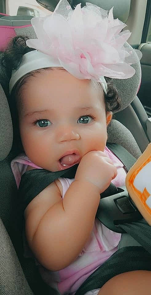 Yvette is registered to the contest to win money with this photo: arm, baby, baby_toddler_clothing, cap, dress, eyelash, flash_photography, fun, happy, headband, headgear, headpiece, helmet, iris, lip, person, petal, pink, skin, sun_hat