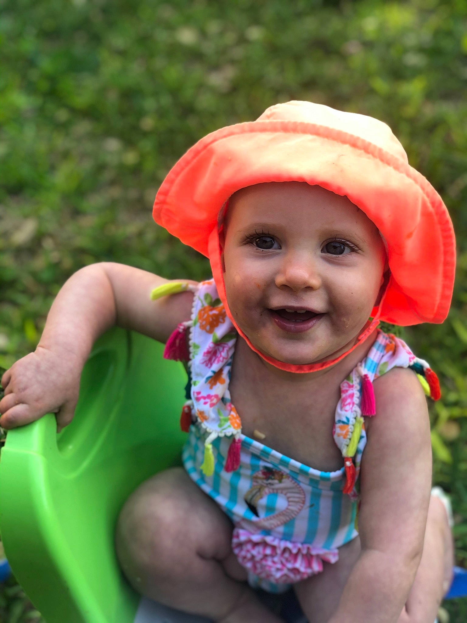 Kinsley is registered to the contest to win money with this photo: baby, child, fun, grass, happy, hat, headgear, headwear, joy, person, play, smile, summer, sun_hat, toddler, vacation