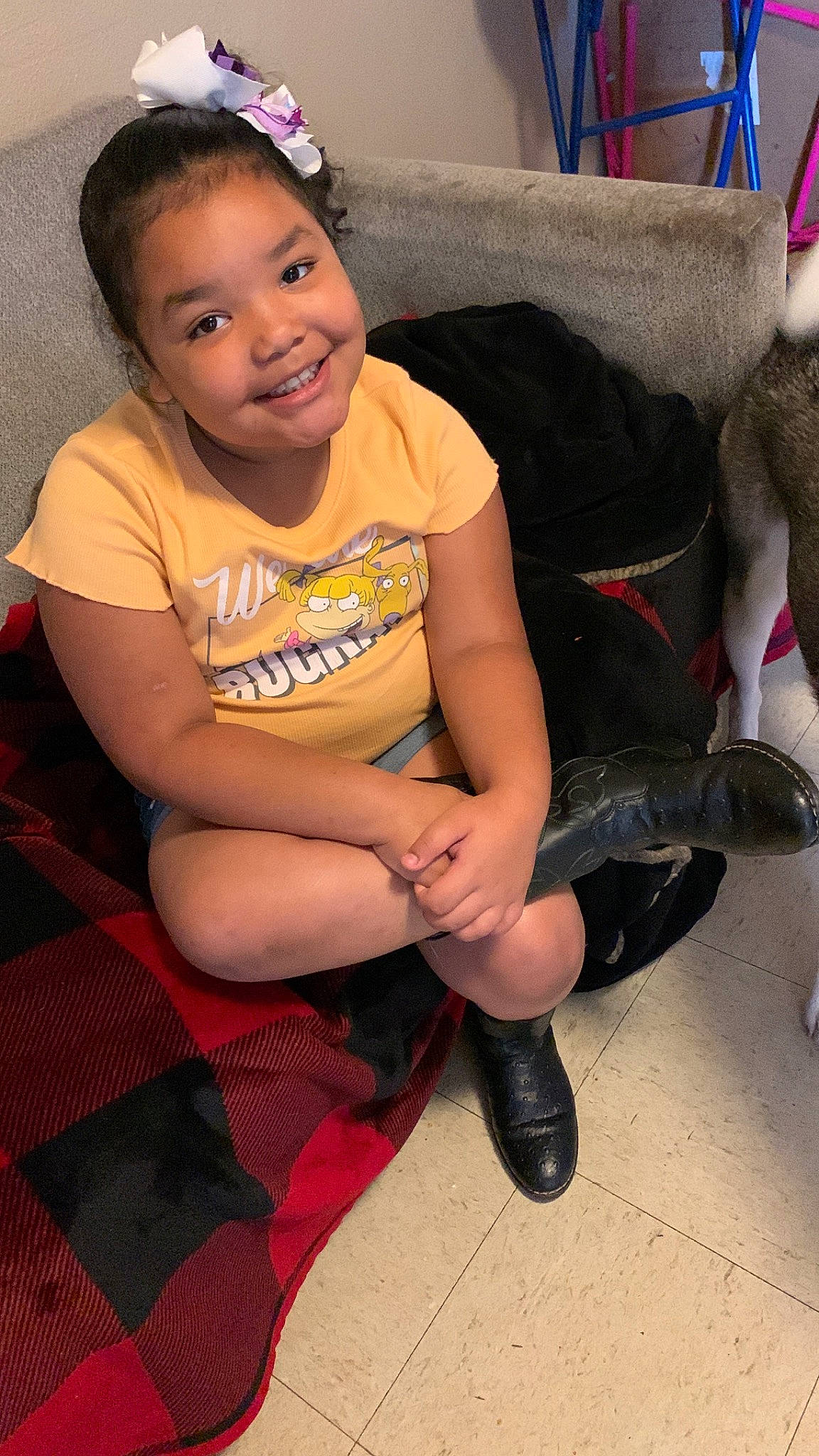 Zendaya is registered to the contest to win money with this photo: black_hair, eye, face, facial_expression, flooring, fun, hair, hairstyle, happy, head, human_body, joy, knee, lap, leg, neck, person, skin, sleeve, smile