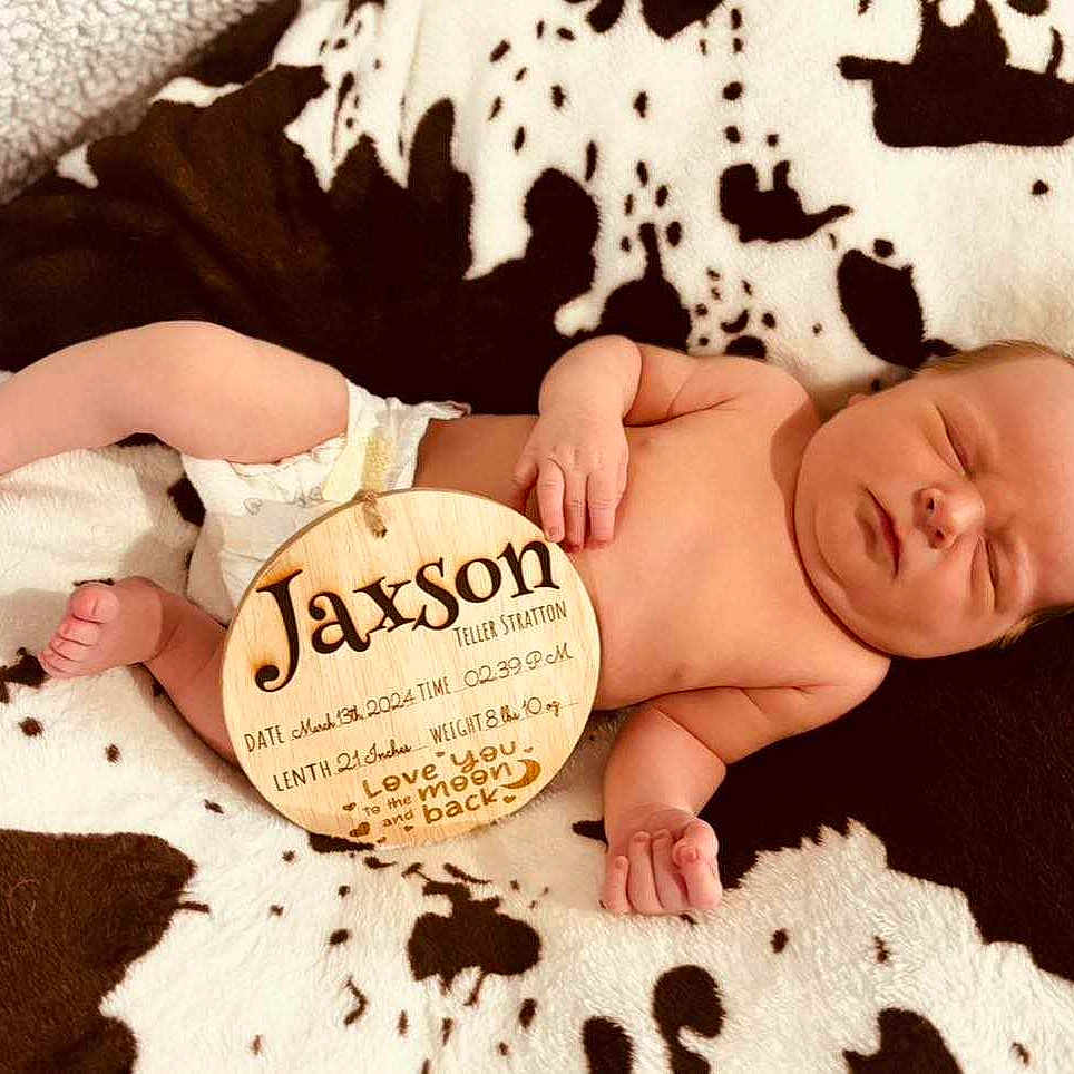 Jaxson is registered to the contest to win money with this photo: animal, baby, bed, blanket, canine, cushion, diaper, dog, face, furniture, head, homedecor, newborn, person, pet, photography, pillow, portrait, quilt, sleeping