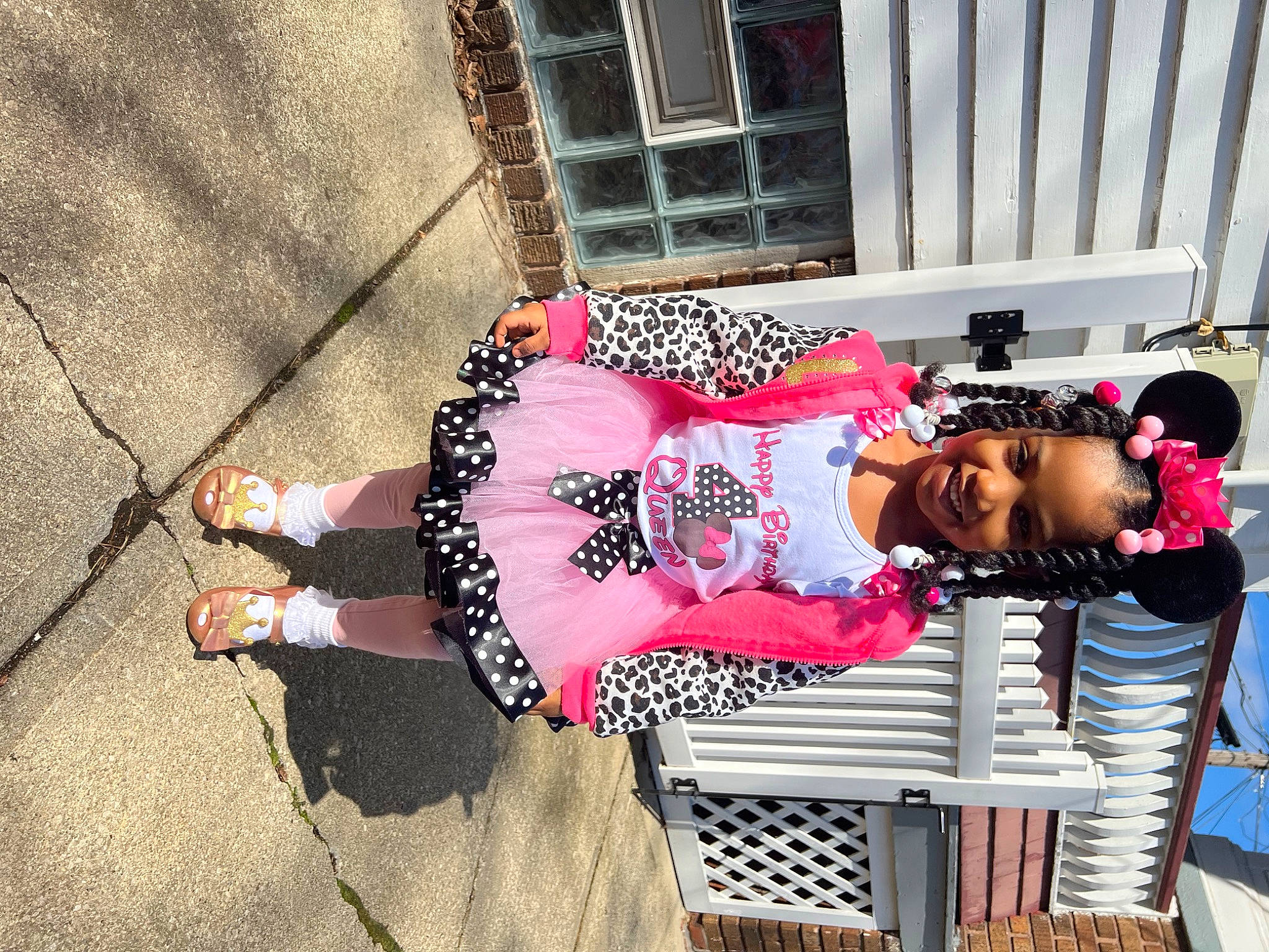 Queen joined the competition — help win amazing prizes! boot, child, eyewear, fun, happy, human_leg, joy, knee, leisure, magenta, outdoor_furniture, pattern, person, pink, sandal, sitting, smile, sunglasses, table, textile