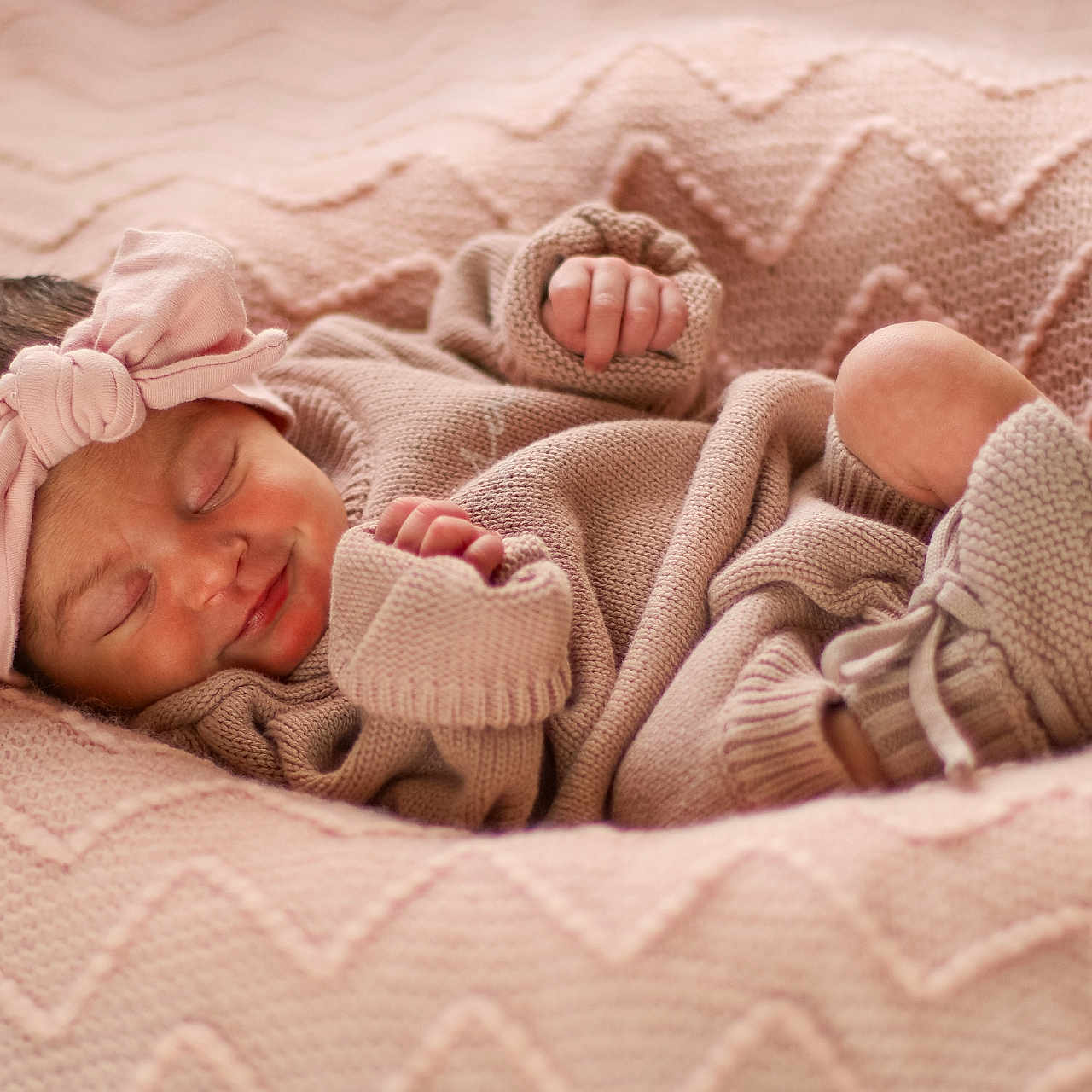 Aurora is registered to the contest to win money with this photo: baby, bed, blanket, bodypart, clothing, face, finger, furniture, hand, happy, hat, head, hosiery, newborn, person, photography, portrait, sleeping, smile, sock