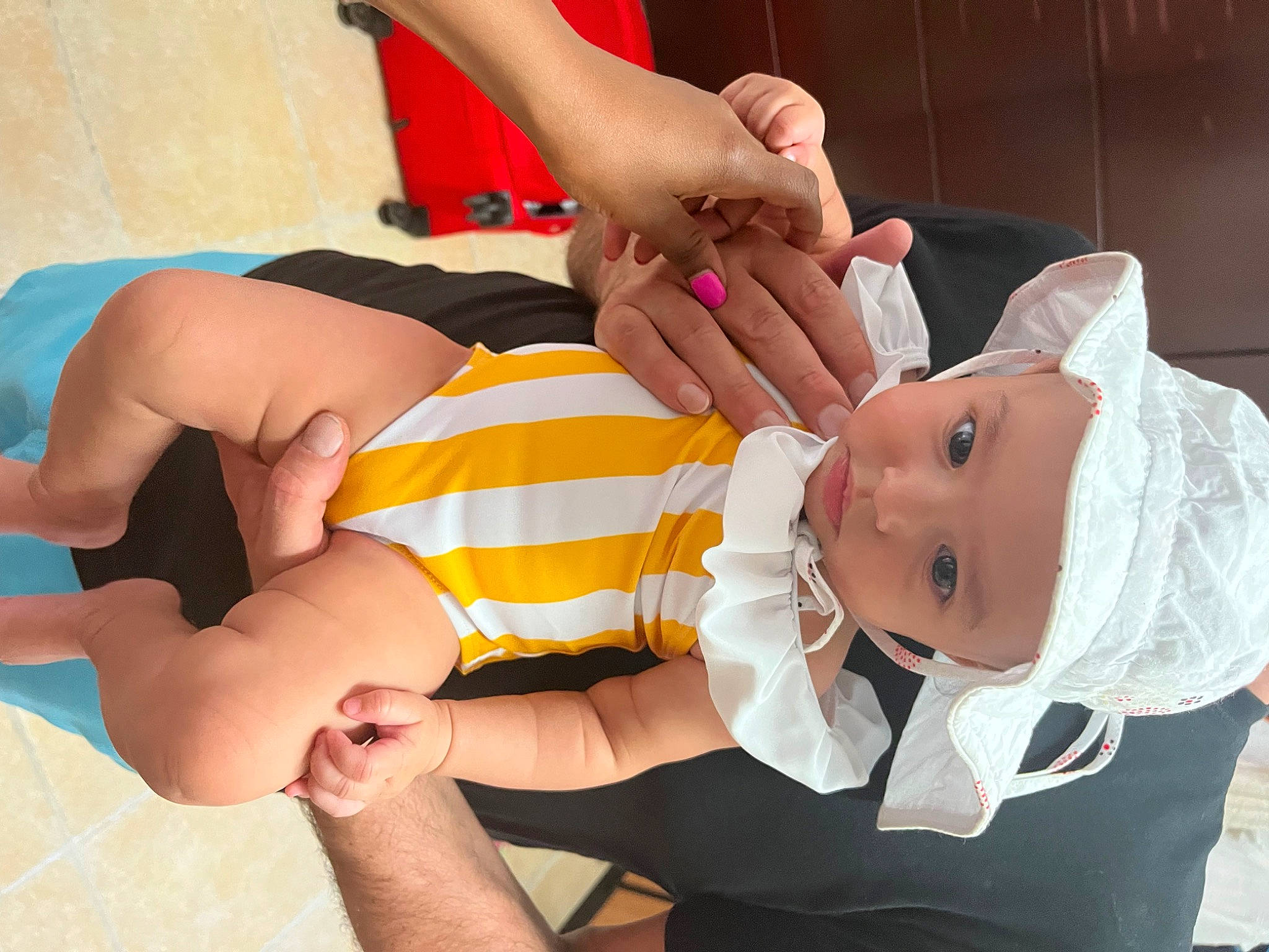 Alena is registered to the contest to win money with this photo: baby, baby_toddler_clothing, child, comfort, elbow, finger, foot, fun, gesture, hand, happy, headwear, human_leg, joint, knee, nail, person, sleeve, textile, thigh