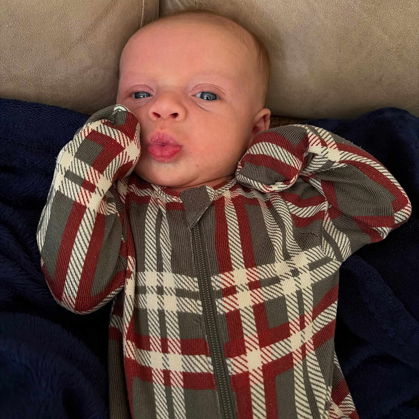 Alban joined the competition — help win amazing prizes! baby, infant, plaid, onesie, clothing, face, expression, couch, blanket, blue, beige, comfort, cute, pucker, young_child, portrait, indoor, sleepwear, child, soft