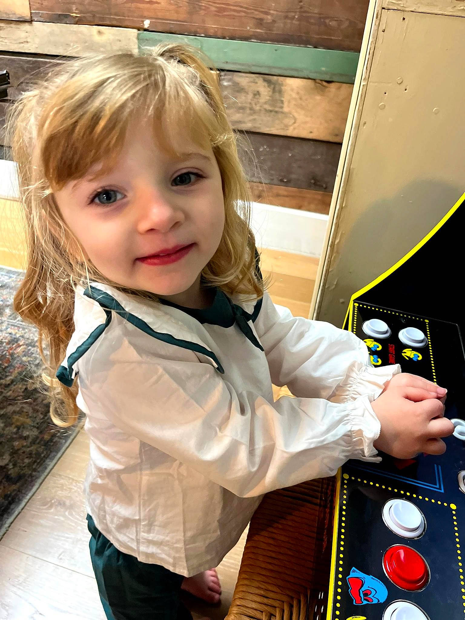 Lucy is registered to the contest to win money with this photo: audio_equipment, bangs, blond, brown_hair, child, cool, electric_blue, fun, gadget, hair_coloring, happy, hoodie, iris, joy, leisure, person, play, portrait_photography, recreation, toddler