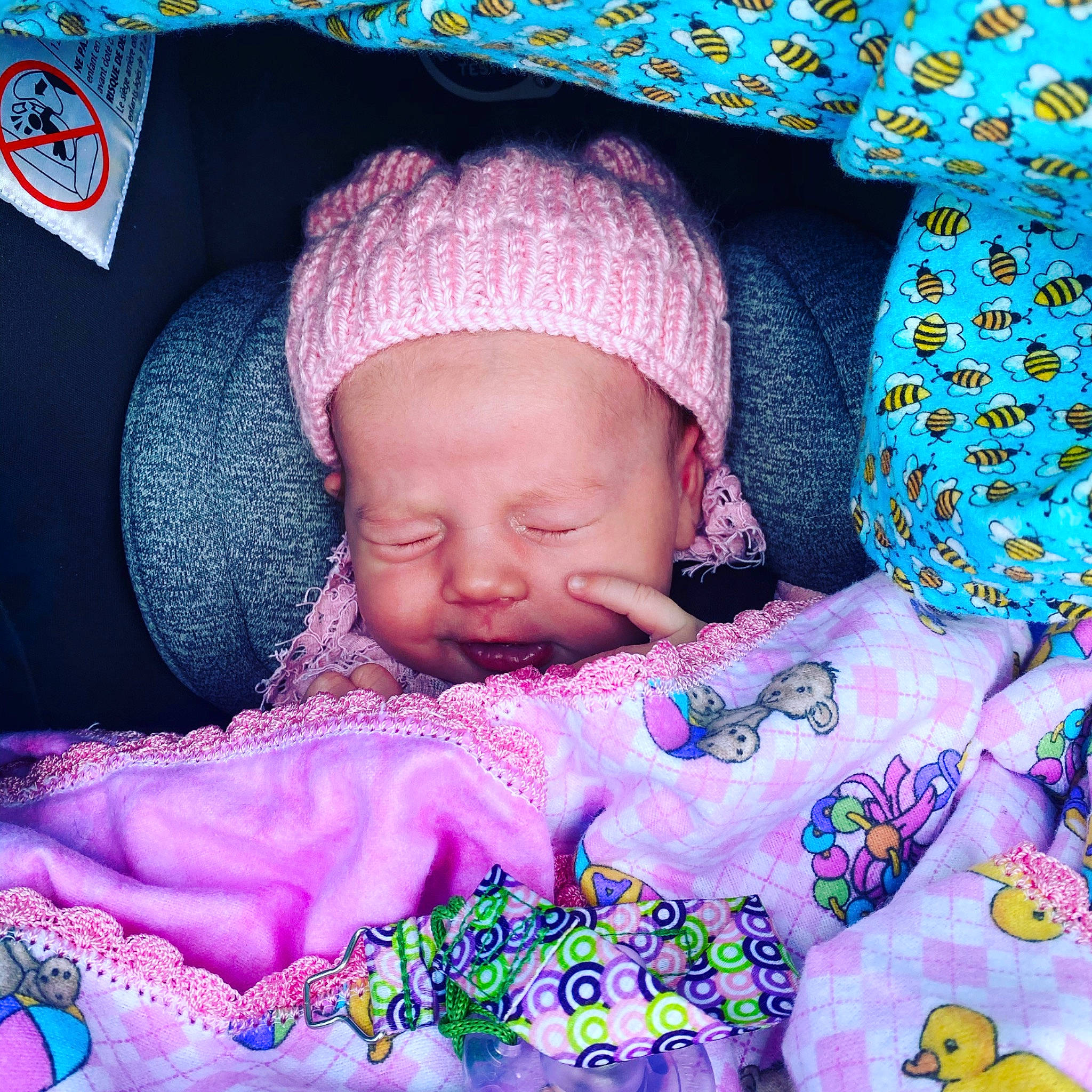 Lacey joined the competition — help win amazing prizes! baby, baby_sleeping, bedtime, bonnet, cheek, child, crochet, headgear, knit_cap, knitting, lavender, lilac, organism, person, photography, pink, product, purple, textile, toddler