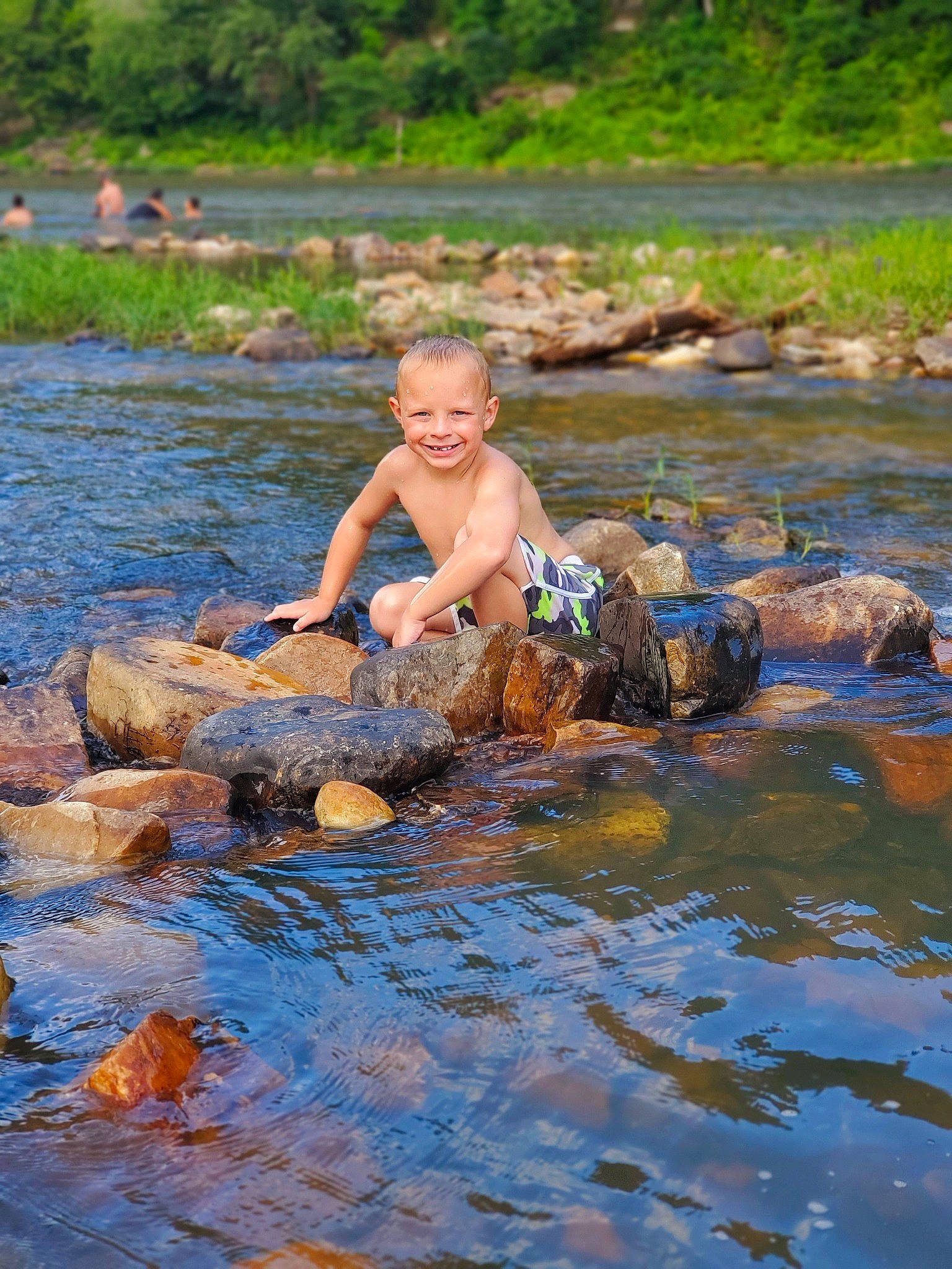 Rilee is registered to the contest to win money with this photo: bank, bathing, creek, fun, joy, leisure, mineral_spring, muscle, person, pond, recreation, reflection, river, rock, stream, summer, vacation, water, water_resources, watercourse
