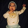 Luka joined the competition — help win amazing prizes! baby, child, infant, face, hand, hat, clothing, sweater, bear_design, cute, expression, looking_up, indoor, portrait, person, dark_background, skin, long_eyelashes, one_hand_up, sleepwear