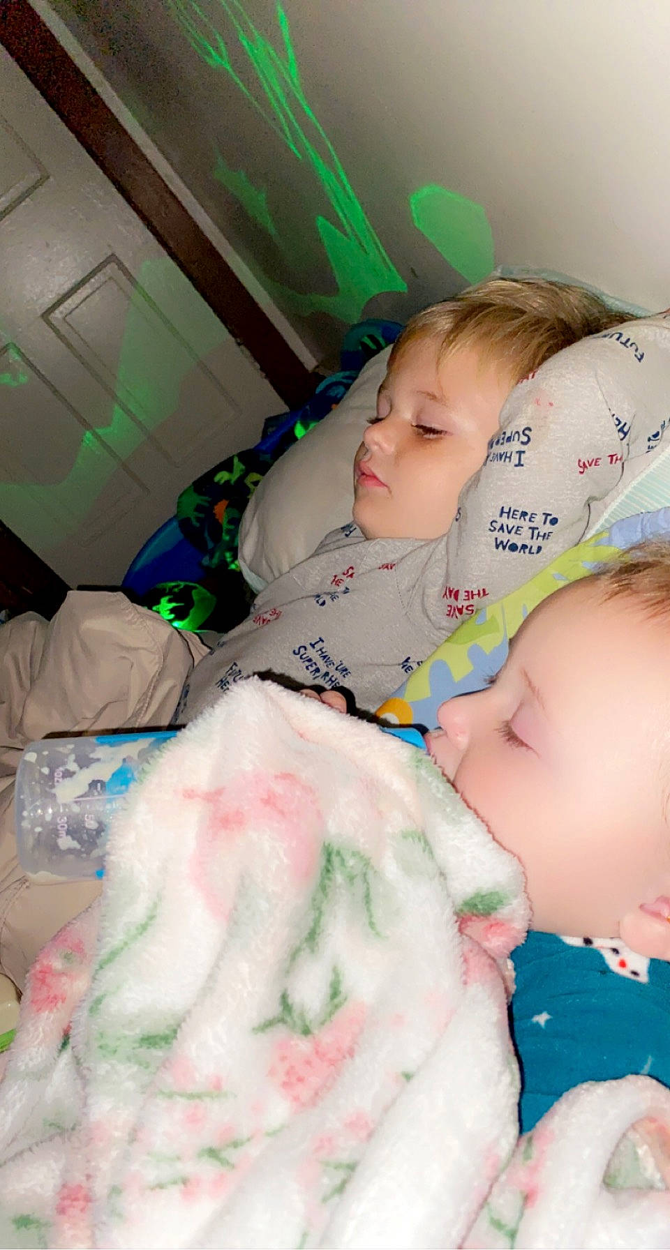 Meek is registered to the contest to win money with this photo: baby, baby_toddler_clothing, cheek, child, comfort, eyelash, facial_expression, green, happy, pattern, person, pink, plastic_bag, room, skin, toddler