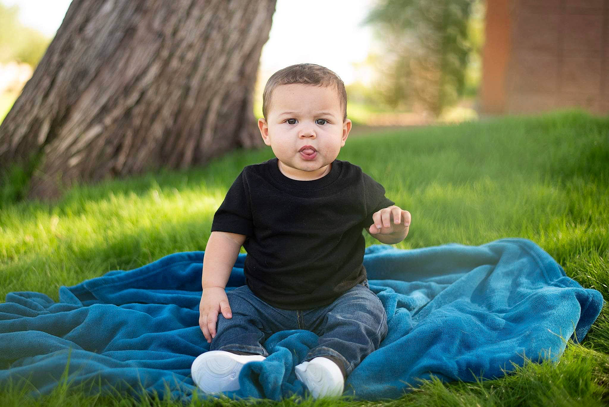 Devin is registered to the contest to win money with this photo: baby, child, face, fun, grass, grass_family, green, happy, lawn, people, people_in_nature, person, photograph, photography, plant, portrait_photography, sitting, smile, summer, toddler