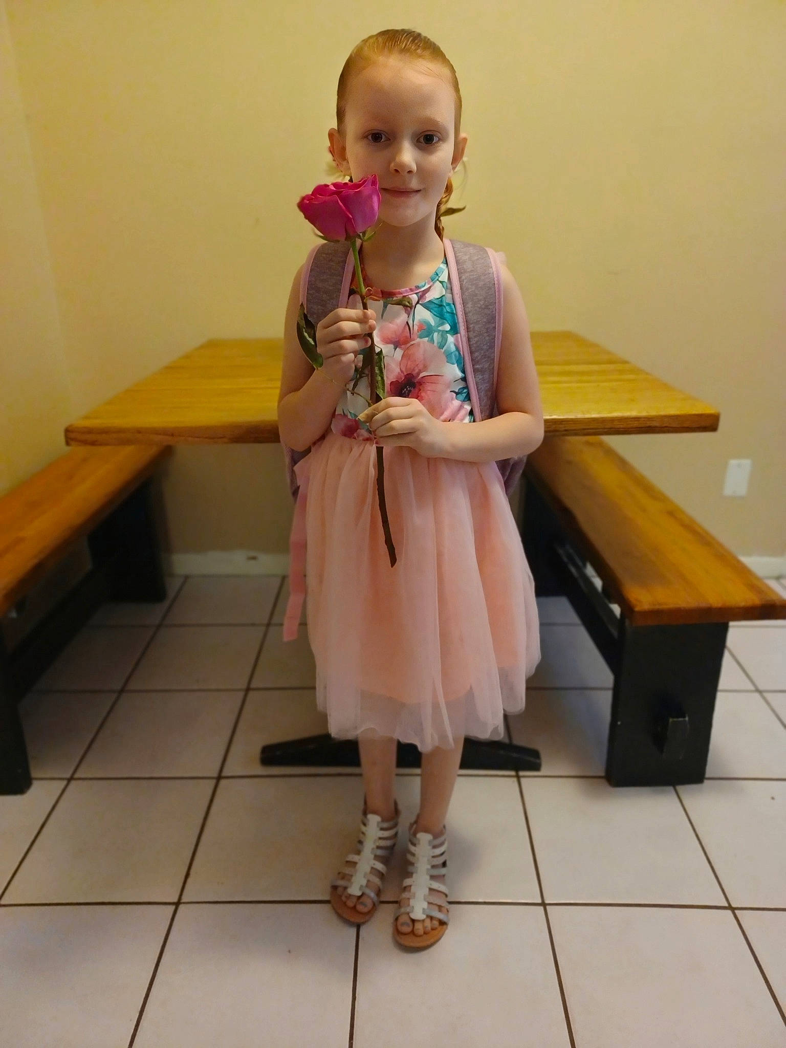 Payten is registered to the contest to win money with this photo: baby_toddler_clothing, dress, face, fashion_design, floor, flooring, hardwood, human_leg, joint, knee, leg, person, shoe, sitting, sleeve, smile, table, thigh, toddler, waist