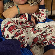 Luna And Leo joined the competition — help win amazing prizes! animal, arm, baby, bed, blanket, blue, cat, child, comfort, cuddle, cute, face, firetruck, indoor, kitten, pajamas, person, resting, skin, white