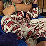 animal, arm, baby, bed, blanket, blue, cat, child, comfort, cuddle, cute, face, firetruck, indoor, kitten, pajamas, person, resting, skin, white