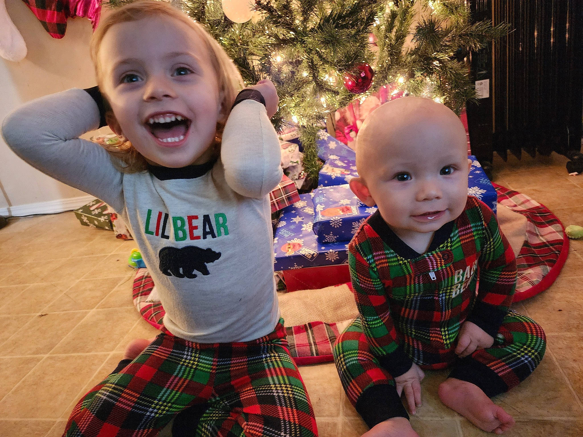 Avery Jo joined the competition — help win amazing prizes! baby, baby_toddler_clothing, christmas_tree, eye, fun, green, happy, head, iris, joy, people, person, photograph, plaid, plant, shorts, skin, sleeve, smile, tartan