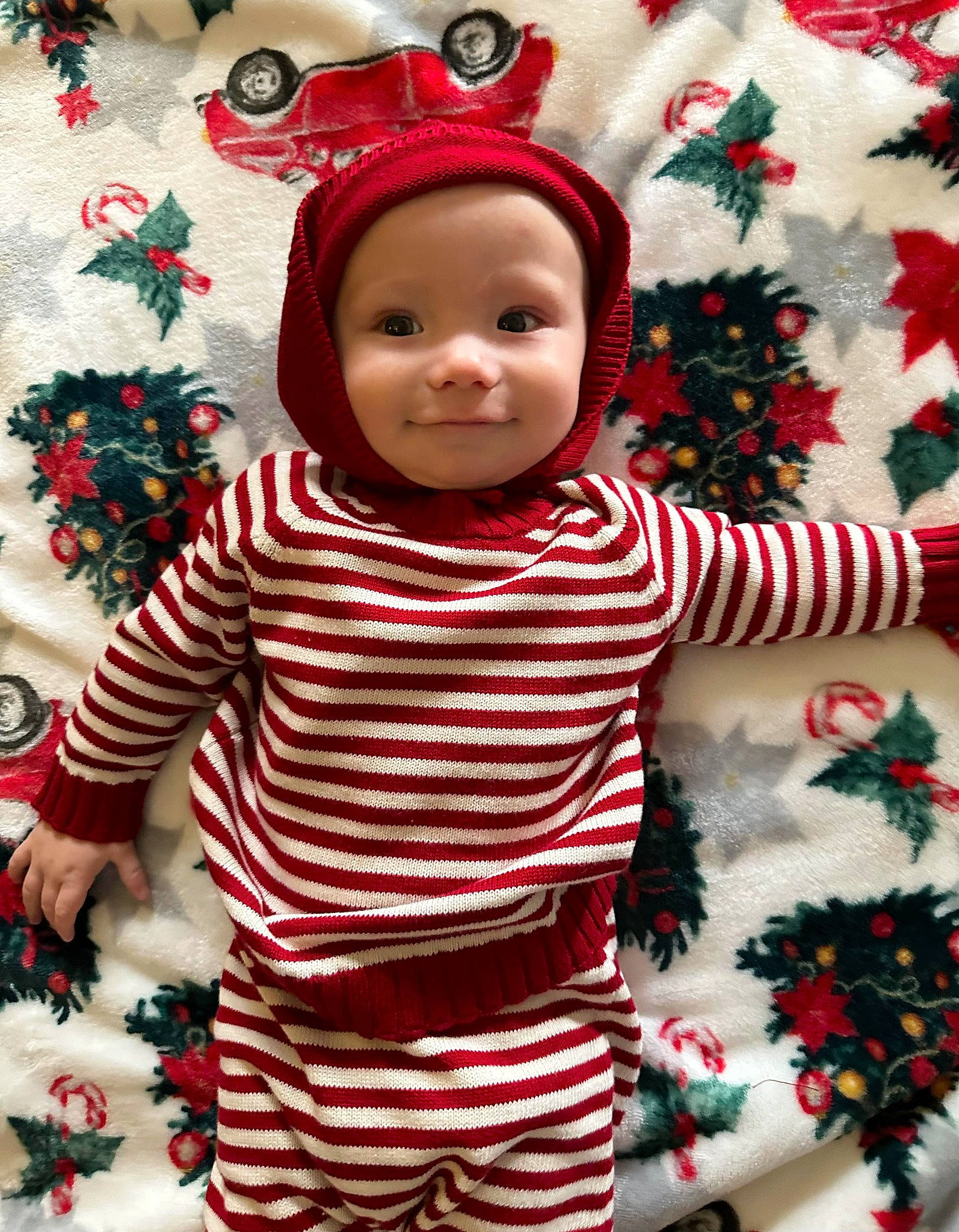 Bodhi is registered to the contest to win money with this photo: baby, baby_toddler_clothing, child, christmas, christmas_decoration, christmas_eve, face, green, happy, headwear, holiday, joy, linens, pattern, person, product, red, sleeve, smile, t_shirt