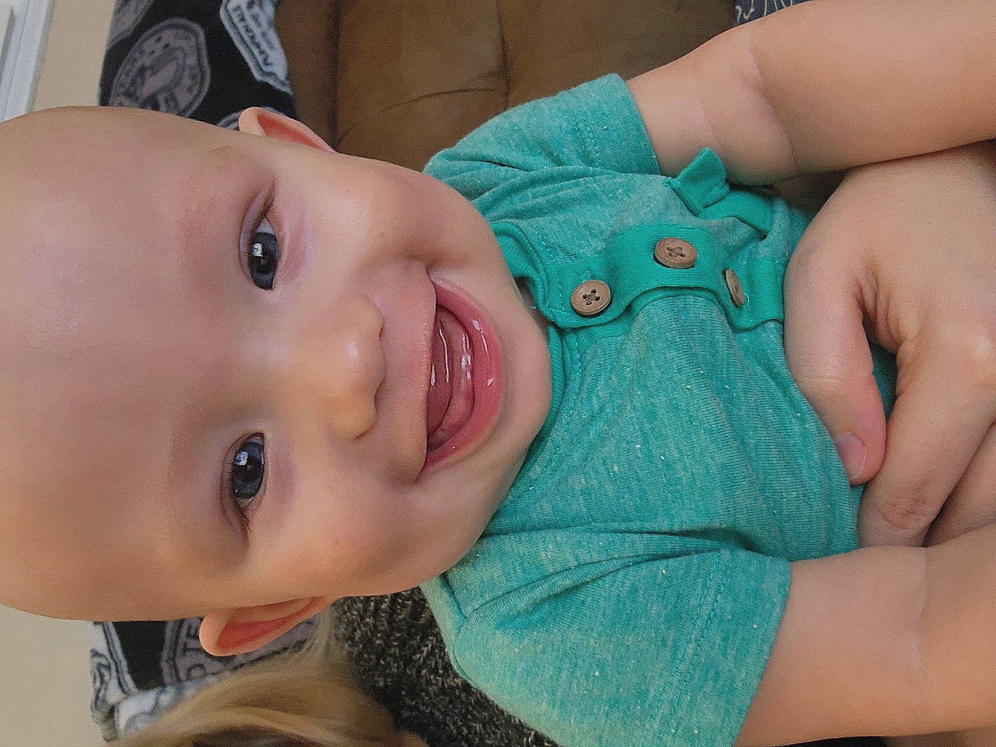 Bodhi is registered to the contest to win money with this photo: arm, baby_toddler_clothing, cheek, chin, eye, eyebrow, eyelash, face, facial_expression, forehead, hand, human_body, iris, joy, lip, mouth, muscle, neck, nose, person