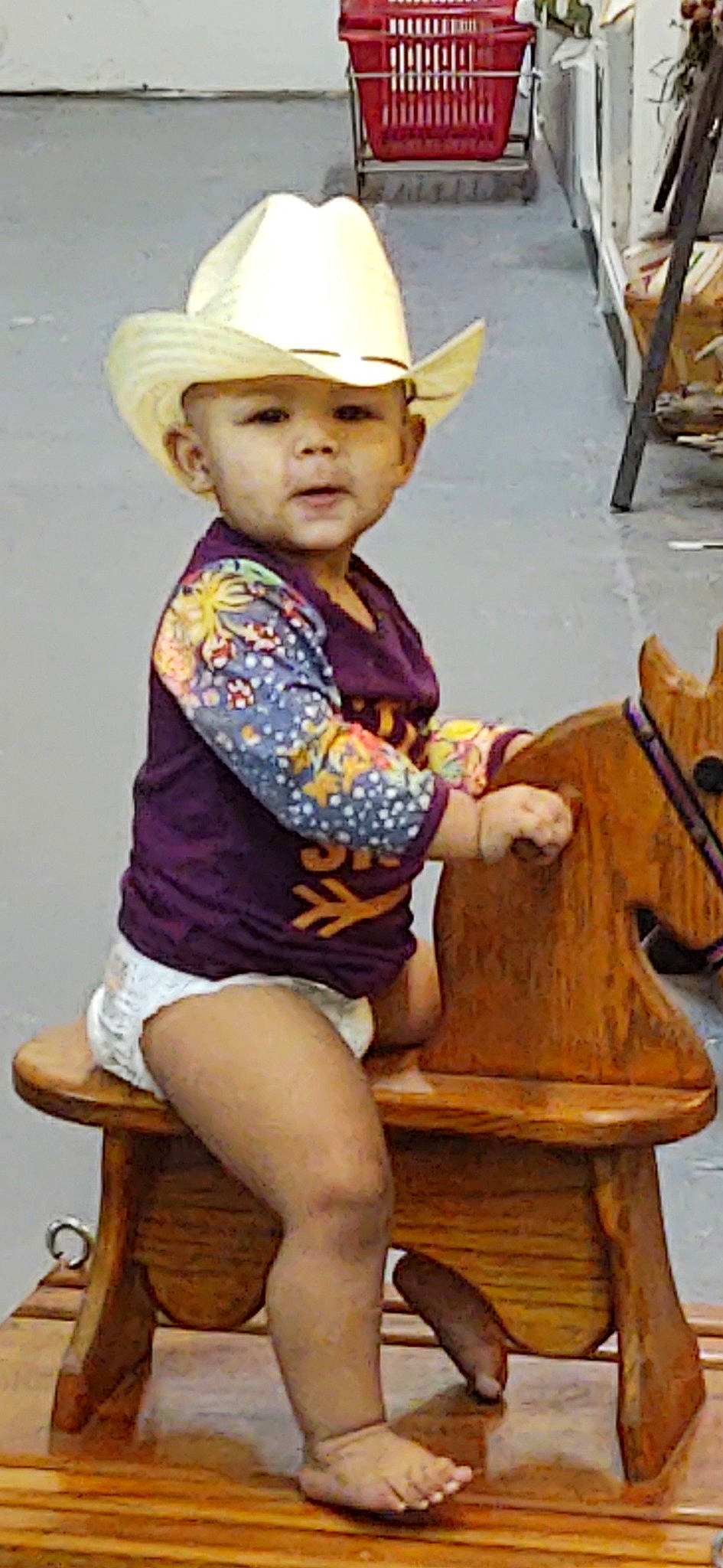 Jaylen joined the competition — help win amazing prizes! cap, cowboy_hat, fashion_accessory, fawn, happy, hat, headgear, headwear, human_leg, knee, leisure, organ, person, recreation, shorts, sitting, sun_hat, thigh, toddler, wood