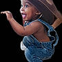 Justin joined the competition — help win amazing prizes! toddler, child, denim_overalls, cowboy_hat, happy, smiling, barefoot, cute, playful, squatting, baby, person, clothing, fun, joy, portrait, studio_shot, isolated, cute_expression, fashion