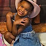 child, girl, smile, cowboy_hat, denim_dress, pose, floor, pink_boot, wooden_background, happy, cute, fashion, indoor, portrait, childhood, playful, western_style, footwear, accessory, young