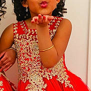 Diana joined the competition — help win amazing prizes! child, girl, red_dress, gold_embroidery, curly_hair, earrings, bracelet, smiling, posing, indoor, portrait, fashion, cute, happy, celebration, elegant, young, person, hand, wall