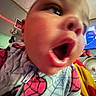 Jamaree joined the competition — help win amazing prizes! baby, child, face, mouth_open, spiderman_outfit, closeup, indoor, television, colorful, expression, person, clothing, head, young_child, blurred_background, toy, blanket, fan, room, decor