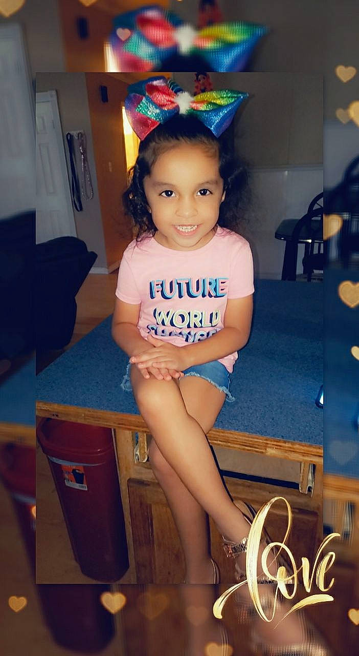 Nikkole Guadalupe Zabala is registered to the contest to win money with this photo: baby_toddler_clothing, chair, child, electric_blue, foot, fun, hair, happy, human_body, human_leg, joy, knee, leg, leisure, person, room, sandal, sitting, smile, t_shirt