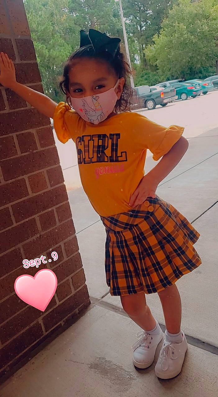 Nikkole Guadalupe Zabala is registered to the contest to win money with this photo: cool, dress, fashion, flooring, fun, hairstyle, happy, human_body, leg, orange, pattern, person, photograph, pink, plaid, red, street_fashion, tartan, textile, thigh