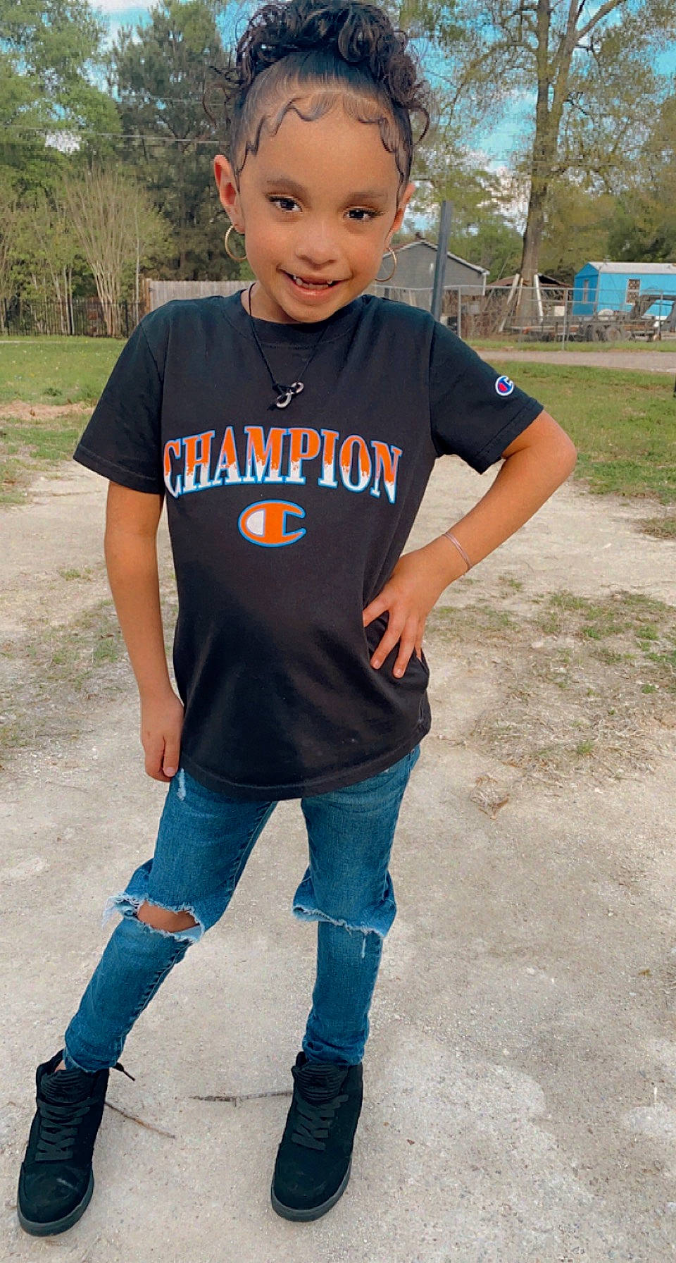 Nikkole is registered to the contest to win money with this photo: clothing, cool, denim, electric_blue, face, footwear, grass, happy, jeans, jersey, joy, leisure, neck, pattern, person, plant, recreation, sleeve, smile, sportswear