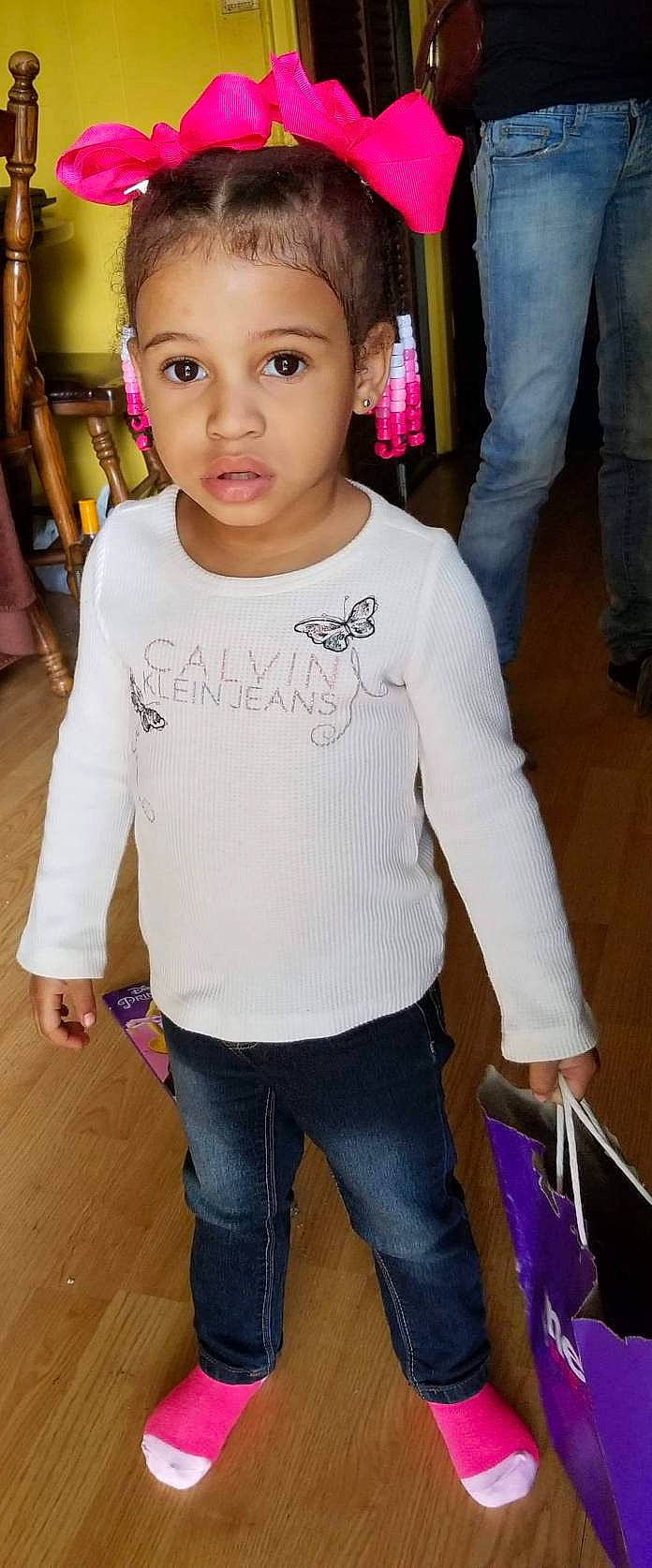 Ja'Niya is registered to the contest to win money with this photo: arm, chest, child, child_model, clothing, cool, jeans, joint, neck, outerwear, person, shoulder, sleeve, smile, t_shirt, toddler, top, trunk