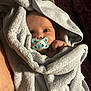 Harry is registered to the contest to win money with this photo: baby, pacifier, towel, wrapped, infant, face, blue, cute, cozy, skin, hand, blanket, newborn, soft, closeup, expression, indoors, lying, portrait, child