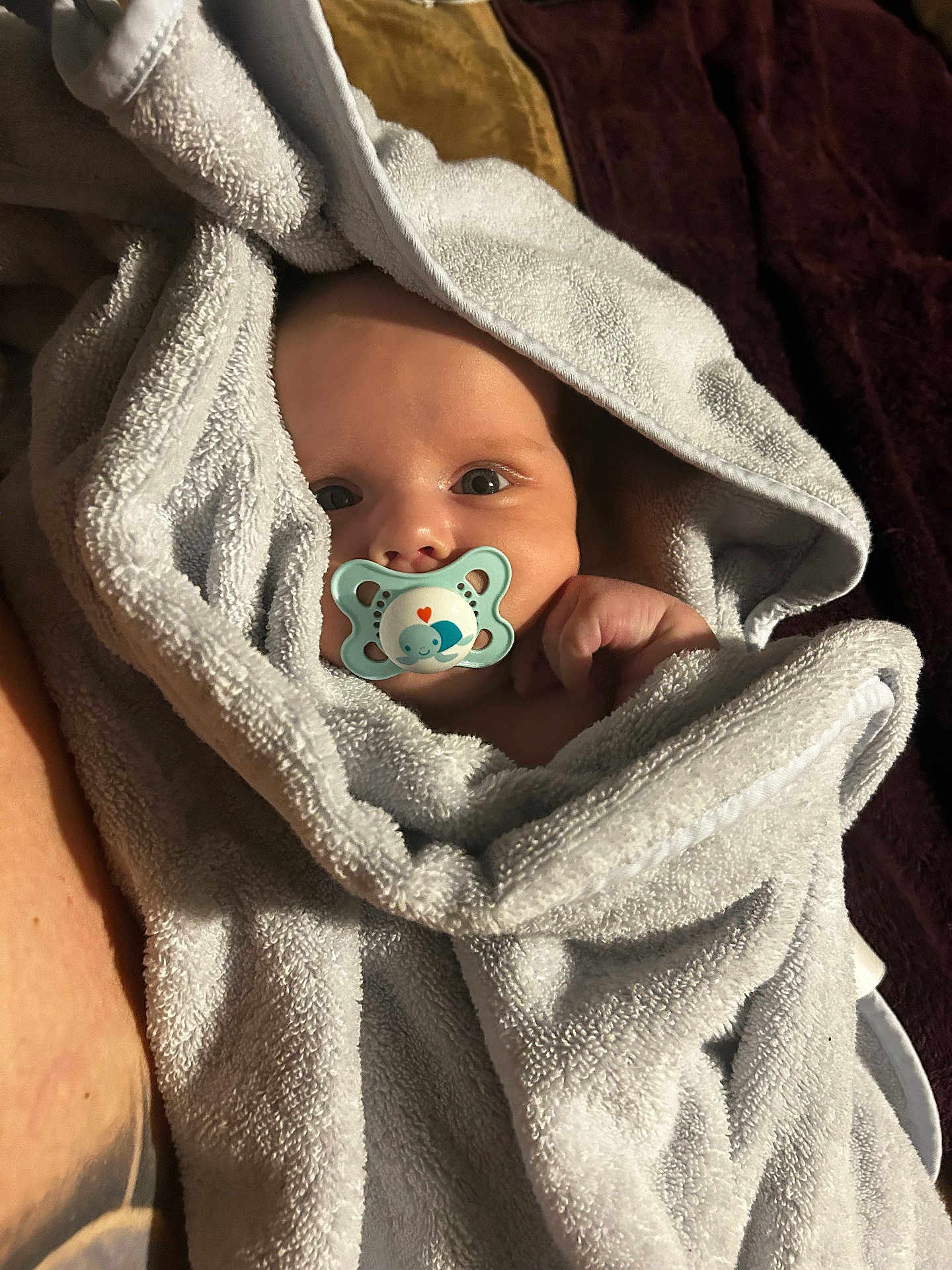 Harry is registered to the contest to win money with this photo: baby, pacifier, towel, wrapped, infant, face, blue, cute, cozy, skin, hand, blanket, newborn, soft, closeup, expression, indoors, lying, portrait, child
