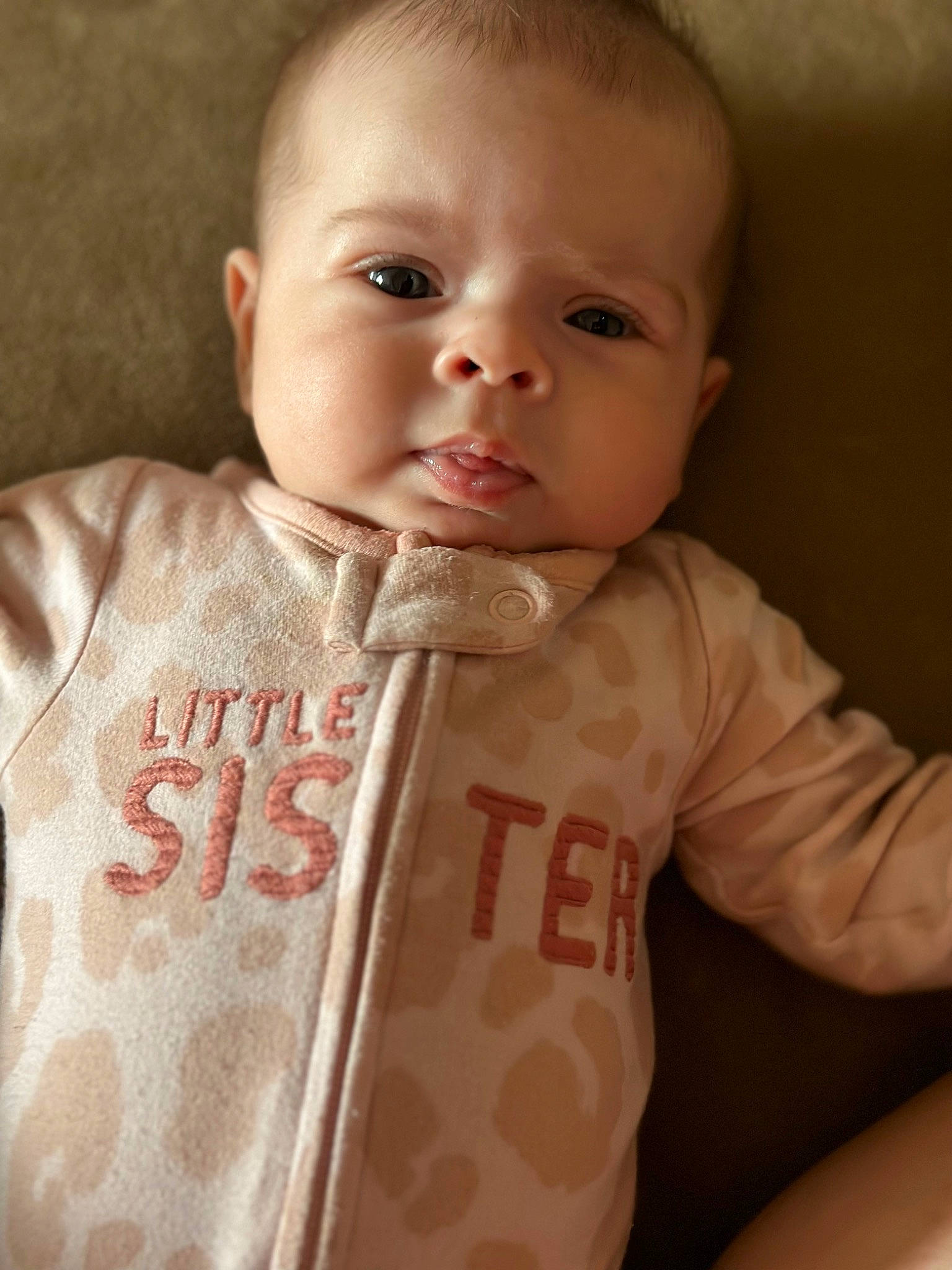 Jazmyn is registered to the contest to win money with this photo: baby, baby_products, baby_toddler_clothing, cheek, child, collar, comfort, eyelash, fur, linens, lip, long_sleeved_t_shirt, neck, outerwear, pattern, person, sitting, skin, sleeve, t_shirt