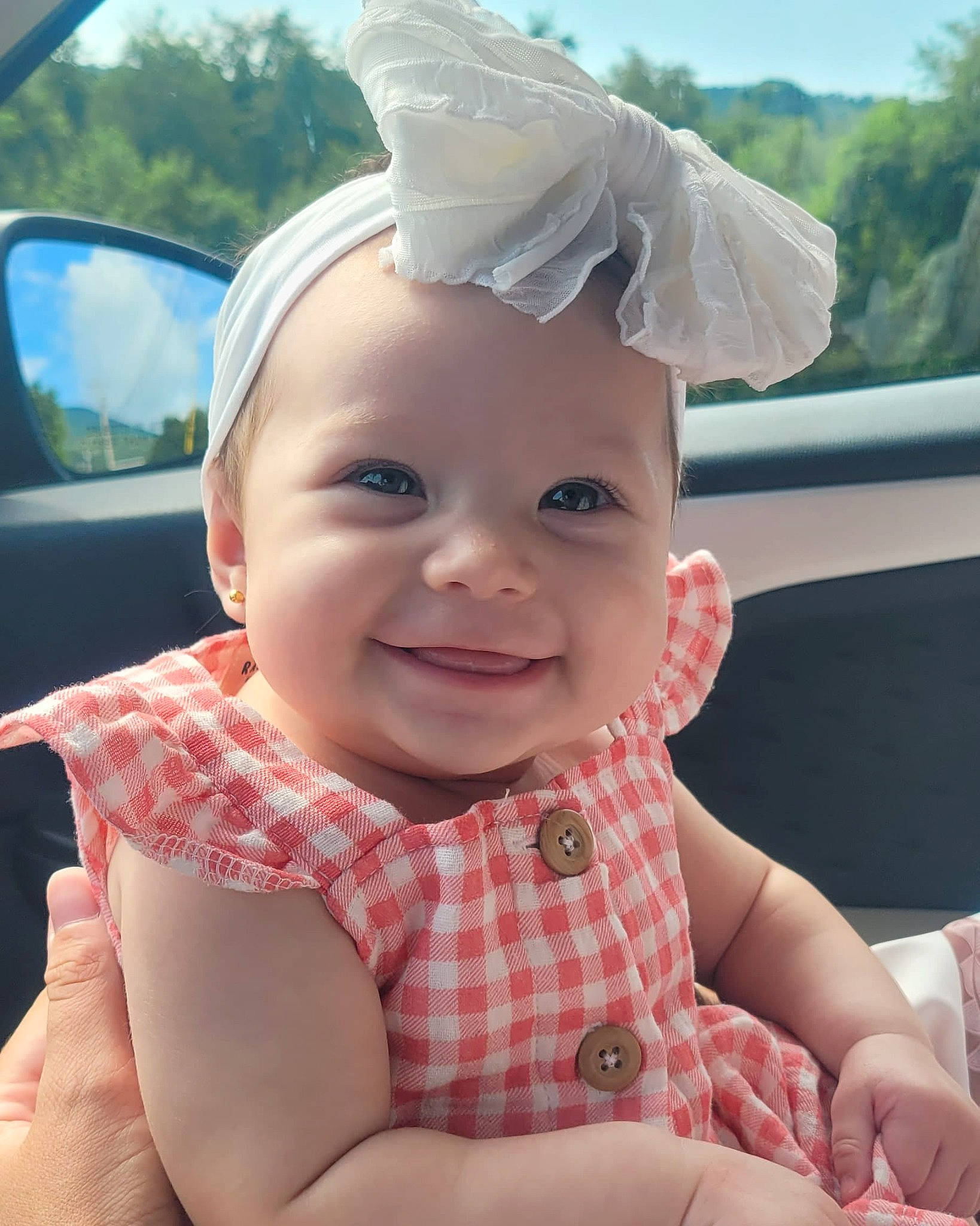 Juniper is registered to the contest to win money with this photo: baby, baby_toddler_clothing, child, chin, face, finger, gesture, hand, happy, hat, joy, lip, mouth, person, pink, product, skin, smile, summer, thumb