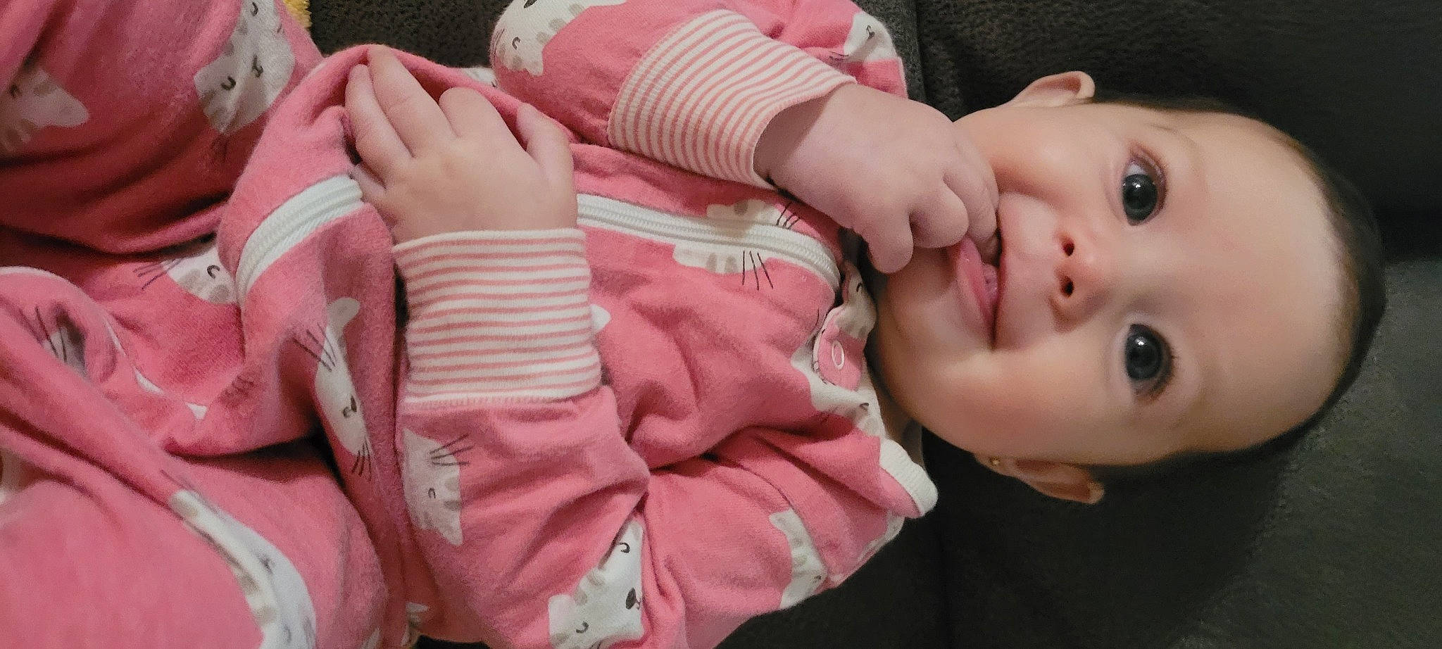 Juniper is registered to the contest to win money with this photo: baby, baby_products, baby_toddler_clothing, cheek, child, comfort, eyelash, grass, happy, human_body, iris, lip, mouth, nail, nose, person, pink, skin, smile, thumb