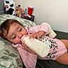 Kali joined the competition — help win amazing prizes! toddler, baby, child, bottle, milk, pink_onesie, cow_print, pillow, bed, blanket, face, hand, sleepy, indoor, person, furniture, nightstand, cup, toy, clothing
