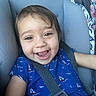 baby, blue_dress, car_seat, cheerful, child, closeup, clothing, cute, face, happy, indoors, infant, person, portrait, safety, sailboat_pattern, seatbelt, smiling, toddler, young_child