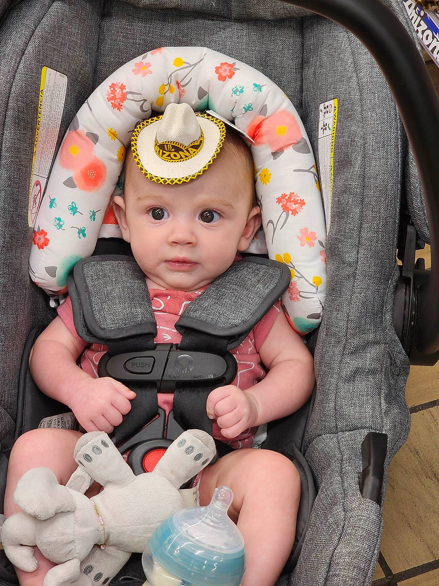 Sophiamarie is registered to the contest to win money with this photo: baby, baby_carriage, baby_products, baby_toddler_clothing, cap, car_seat, cheek, child, comfort, eye, fashion_accessory, head, headwear, knit_cap, pattern, person, product, sitting, skin, sleeve