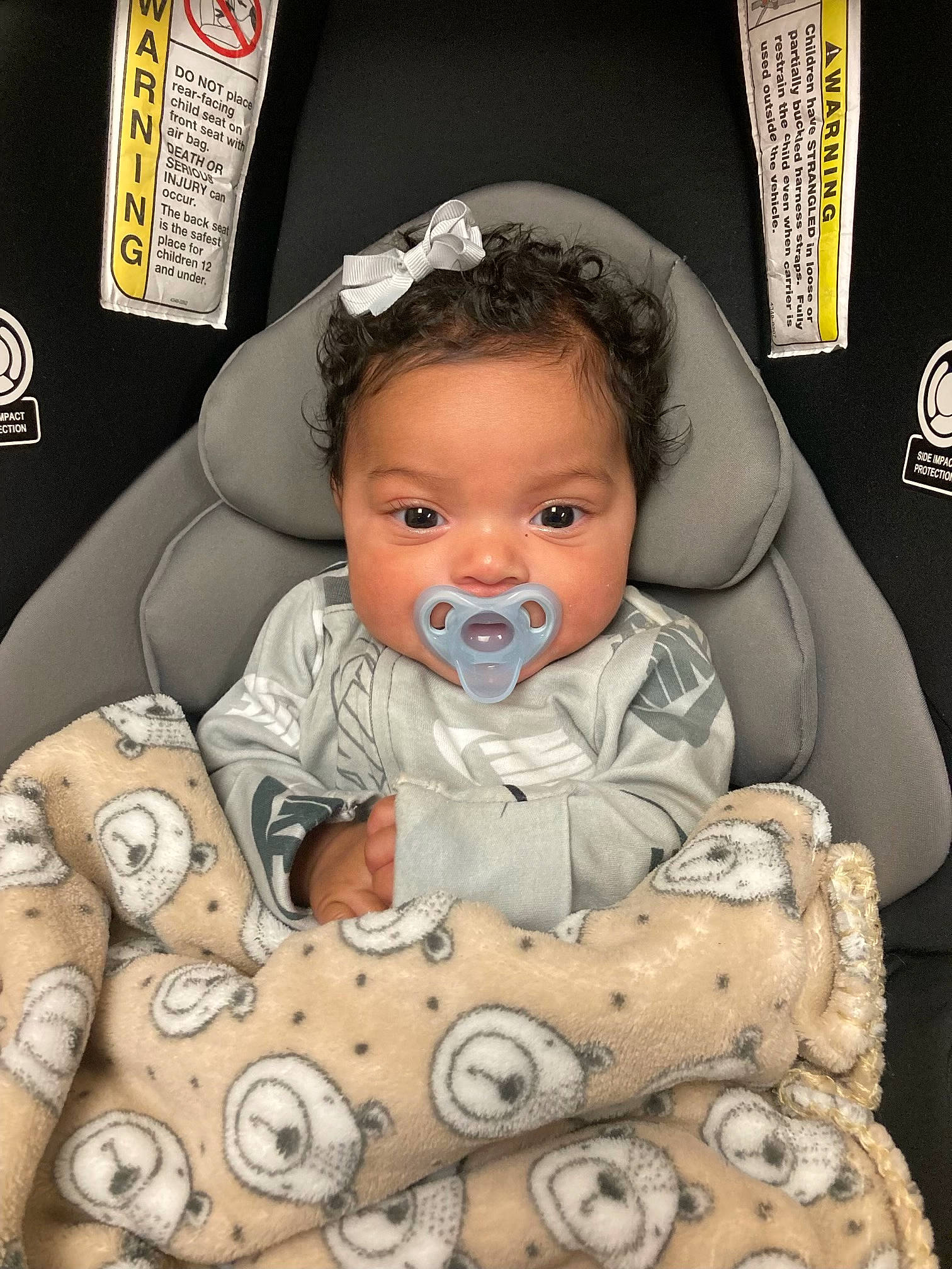 Kamora is registered to the contest to win money with this photo: art, baby, baby_products, baby_toddler_clothing, cheek, child, comfort, event, face, facial_expression, happy, head, linens, outerwear, pattern, person, picture_frame, room, sitting, textile