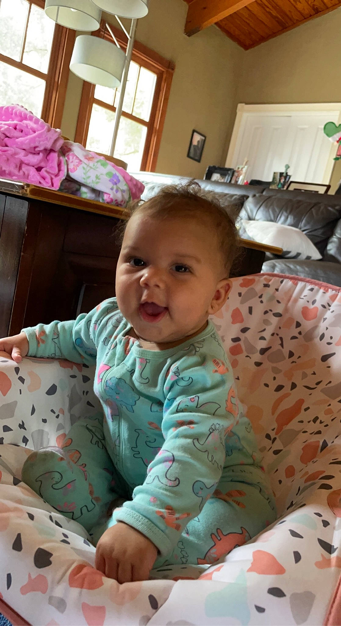 Bentleigh is registered to the contest to win money with this photo: baby, baby_toddler_clothing, cheek, child, comfort, eye, finger, head, human_body, iris, mammal, organ, people, person, pink, skin, smile, textile, toddler, white