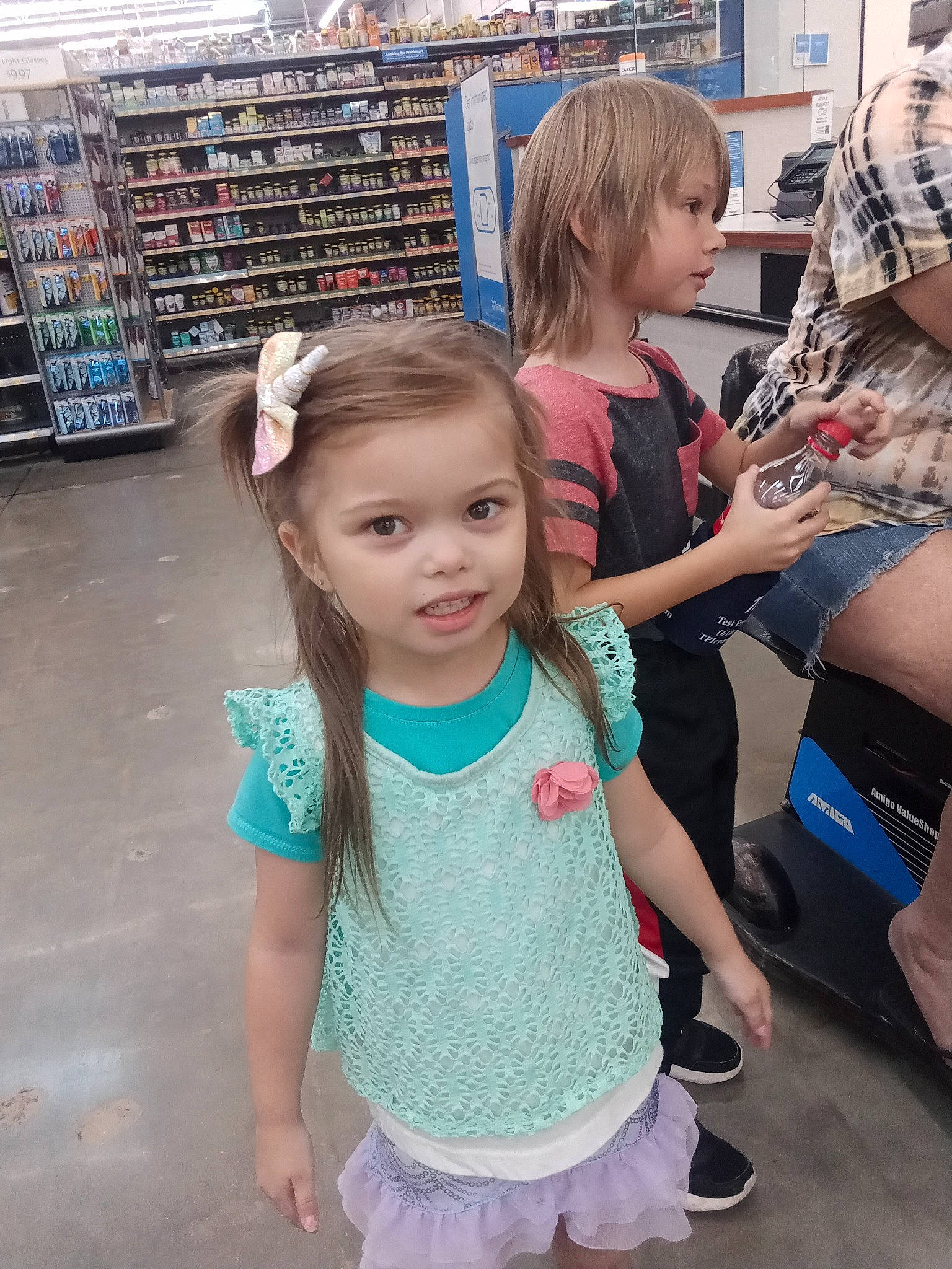 Delila is registered to the contest to win money with this photo: arm, baby_toddler_clothing, beauty, child, face, fun, hair, happy, joint, leg, leisure, person, photograph, pink, shelf, shoulder, skin, standing, summer, t_shirt