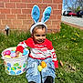 Kross is registered to the contest to win money with this photo: child, toddler, bunny_ears, easter_eggs, bucket, grass, red_shirt, jeans, black_socks, smiling, outdoor, spring, sunny, brick_wall, parking_lot, colorful, happy, playful, festive, holiday