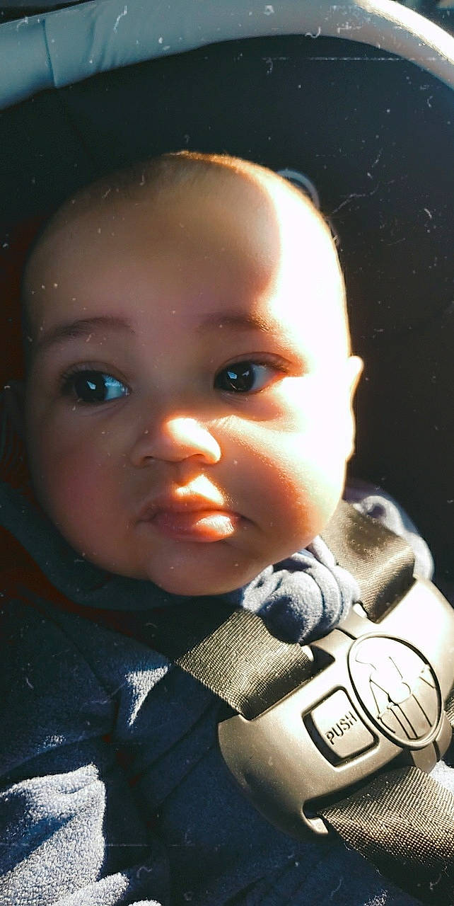 Damian joined the competition — help win amazing prizes! baby, baby_toddler_clothing, camera, carmine, cheek, child, close_up, darkness, eyelash, finger, flash_photography, fun, happy, lip, nose, person, personal_protective_equipment, portrait_photography, sitting, toddler